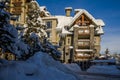 A Christmas Story in Whistler  village - Snow-covered buildings - on the roofs, Ski resort. A cold but clear sunny winter day. Royalty Free Stock Photo