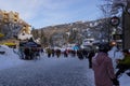 Christmas Story in Whistler village - Snow-covered buildings - on the roofs, Ski resort - people walking to gondola. Royalty Free Stock Photo