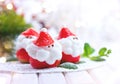 Christmas strawberry Santa. Funny dessert stuffed with whipped cream