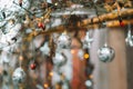 Christmas street decor in silver tones.Metallic silver street decor. balls and stars, shining garlands on tree branches