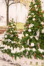 Christmas street decoration. Fur trees with balls and garlands Royalty Free Stock Photo