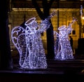 Christmas street decorations - angels playing trumpets made of l