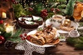 Christmas strudel with poppy seeds and chocolate poppy cake with apple on festive table Royalty Free Stock Photo