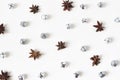 Christmas styled stock composition. Glittering silver jingle bells and anise stars on white background. Flat lay, top