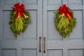 Christmas Swags Hanging on Gray Doors