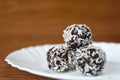 Christmas sweets on a plate - Rum balls in coconut. Traditional homemade handmade Czech sweets. Royalty Free Stock Photo