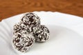 Christmas sweets on a plate - Rum balls in coconut. Traditional homemade handmade Czech sweets. Royalty Free Stock Photo