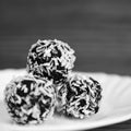 Christmas sweets on a plate - Rum balls in coconut. Traditional homemade handmade Czech sweets. Royalty Free Stock Photo