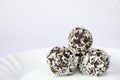 Christmas sweets on a plate - Rum balls in coconut. Traditional homemade handmade Czech sweets. Royalty Free Stock Photo