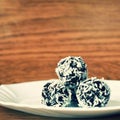 Christmas sweets on a plate - Rum balls in coconut. Traditional homemade handmade Czech sweets. Royalty Free Stock Photo