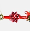 Christmas symbols and ornaments. Christmas bell, a red bow, a gold Christmas tree toy Royalty Free Stock Photo