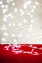 Christmas table on the background of Christmas lights bokeh Royalty Free Stock Photo