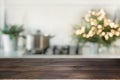 Christmas Table Background With Christmas Tree In Kitchen Out Of Focus. Background For Display Your Products