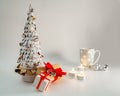 Christmas table decoration banner. White hand made fir. Craft paper red gift boxes recycle materials candles lights cup Royalty Free Stock Photo