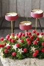 Christmas table decoration with red berries and candles Royalty Free Stock Photo