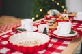 Christmas table decoration in red tones focusing the camera on Royalty Free Stock Photo
