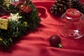 Christmas table decorations with a scented candle on a clear glass base
