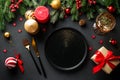 Christmas table. Christmas dinner holiday food with elegant decorations on black. Royalty Free Stock Photo