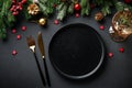 Christmas table. Christmas dinner holiday food with elegant decorations on black. Royalty Free Stock Photo
