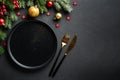 Christmas table. Christmas dinner holiday food with elegant decorations on black. Royalty Free Stock Photo