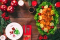 Christmas table dinner time with roasted meats, candles and New Year decor. Background thanksgiving.