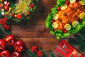 Christmas table dinner time with roasted meats decorated in Christmas style. Background thanksgiving. The concept of a family holi Royalty Free Stock Photo