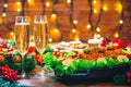 Christmas table dinner time with roasted meats decorated in Christmas style. Background thanksgiving. The concept of a family holi Royalty Free Stock Photo