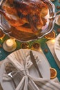 Christmas table, festive baked turkey, and served table. Vertical frame