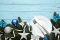 Christmas table place setting with blue and silver decoration on blue. Holidays background Royalty Free Stock Photo