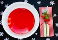 Christmas table place setting with empty red plate, christmas de Royalty Free Stock Photo