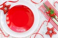 Christmas table place setting with empty red plate, christmas de