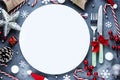 Christmas table place setting with empty white plate and cutlery with festive decorations Royalty Free Stock Photo