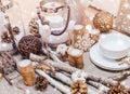 Christmas table place setting with christmas pine cones, wooden decorations, bokeh, snowflakes. Xmas and Happy New Year theme