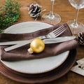 Christmas table place setting in vintage or rustic style. Royalty Free Stock Photo