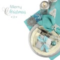 Christmas table place settings in aqua blue, silver and white