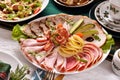 Christmas table with a platter of sliced ham and cured meats Royalty Free Stock Photo