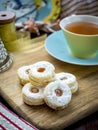 Homemade Christmas cookies with a cup of tea, top view over a rustic wood background Royalty Free Stock Photo