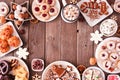 Christmas baking table scene of mixed sweets and cookies, above view over a rustic wood background
