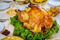 Christmas table served with turkey, decorated with kale and cranberry Royalty Free Stock Photo