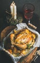 Christmas table set with oven roasted whole chicken and wine Royalty Free Stock Photo