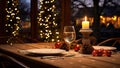 Christmas table setting with candles and decorations on the background of Christmas lights Royalty Free Stock Photo