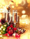 Christmas table setting with champagne. New Year celebration Royalty Free Stock Photo