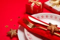 Christmas laying table appointments, table setting options. Silverware, tableware items with festive decoration