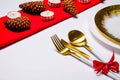 Christmas laying table appointments, table setting options. Silverware, tableware items with festive decoration