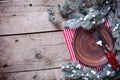 Christmas table setting. Empty plate, knife and fork, napkin o