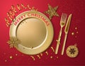 Christmas table setting, gold plate, fork, knife and tinsel, snowflake, star, serpentine on a red background for Christmas, New