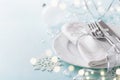 Christmas table setting for holiday dinner. Bokeh effect. Empty space for menu Royalty Free Stock Photo