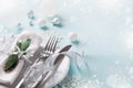 Christmas table setting for holiday dinner. Bokeh effect. Empty space for menu Royalty Free Stock Photo