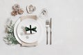 Christmas table setting with New Year decorations on gray background. Copy space, top view, flat lay Royalty Free Stock Photo