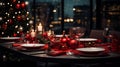 Christmas table setting with red tableware and cutlery in restaurant. New Yearâs Eve. Royalty Free Stock Photo